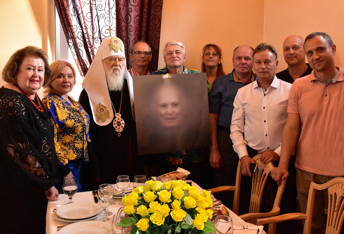 Members of the Soul of Ukraine International Foundation at a party in honor of the 100th anniversary of Boris Paton demonstrate the portrait «Genius», which was created by Artificial Intelligence. Brovary City, 2019